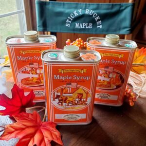 Three jars of maple syrup