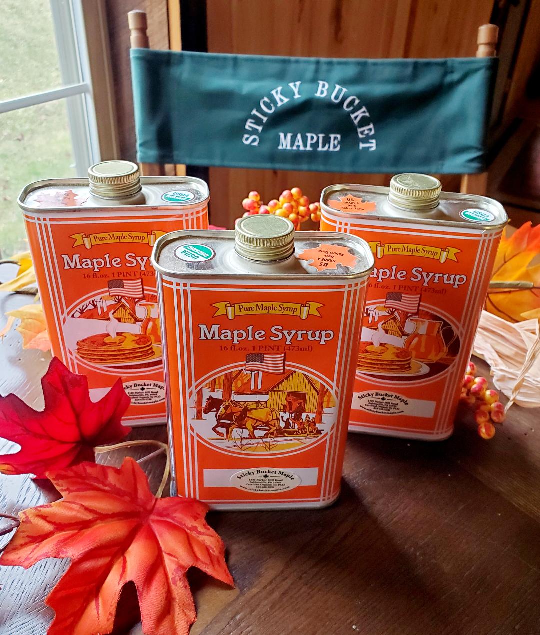 Three jars of maple syrup